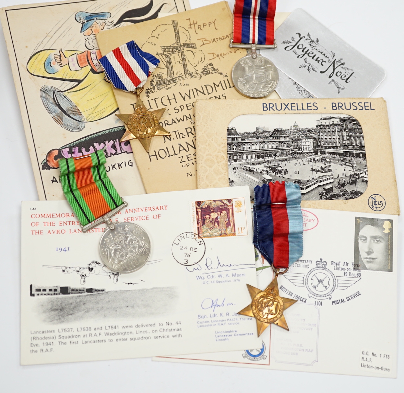 An RAF silver mug, and framed drawing of a map of Belgium and surrounding countries relating to 83rd Group Main HQ, Tactical Air Force 1944-45 together with four WWII medals in the original card, issue box; the Defence M